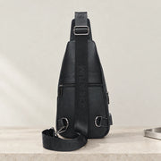 Dos de la sacoche bandoulière noire avec poche arrière zippée