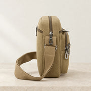 Profil de la sacoche en tissu beige avec sangle